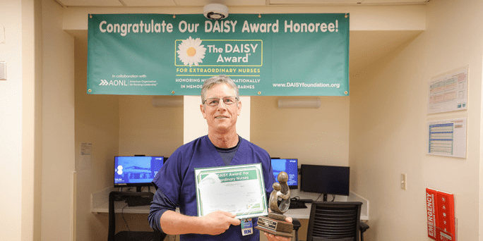 Brian Ambrosini with Daisy award